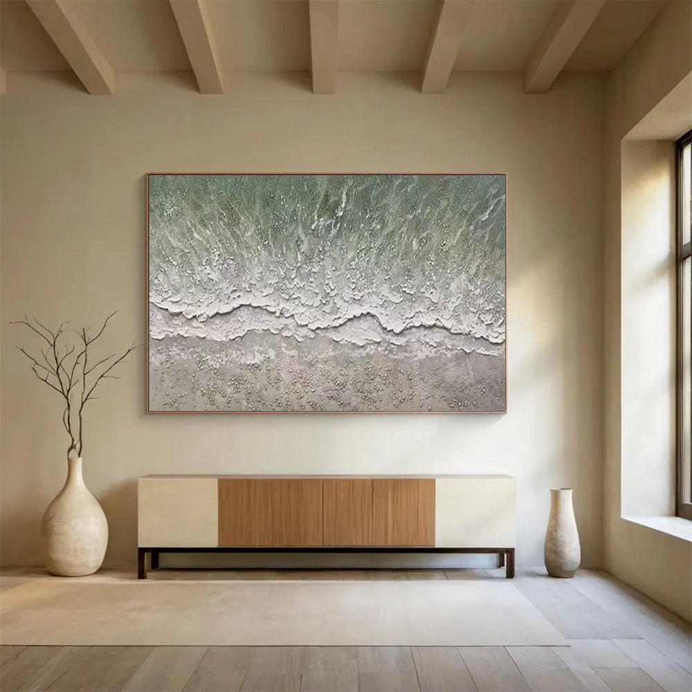 Aerial view of a beach with gentle waves and a textured shore CT1667