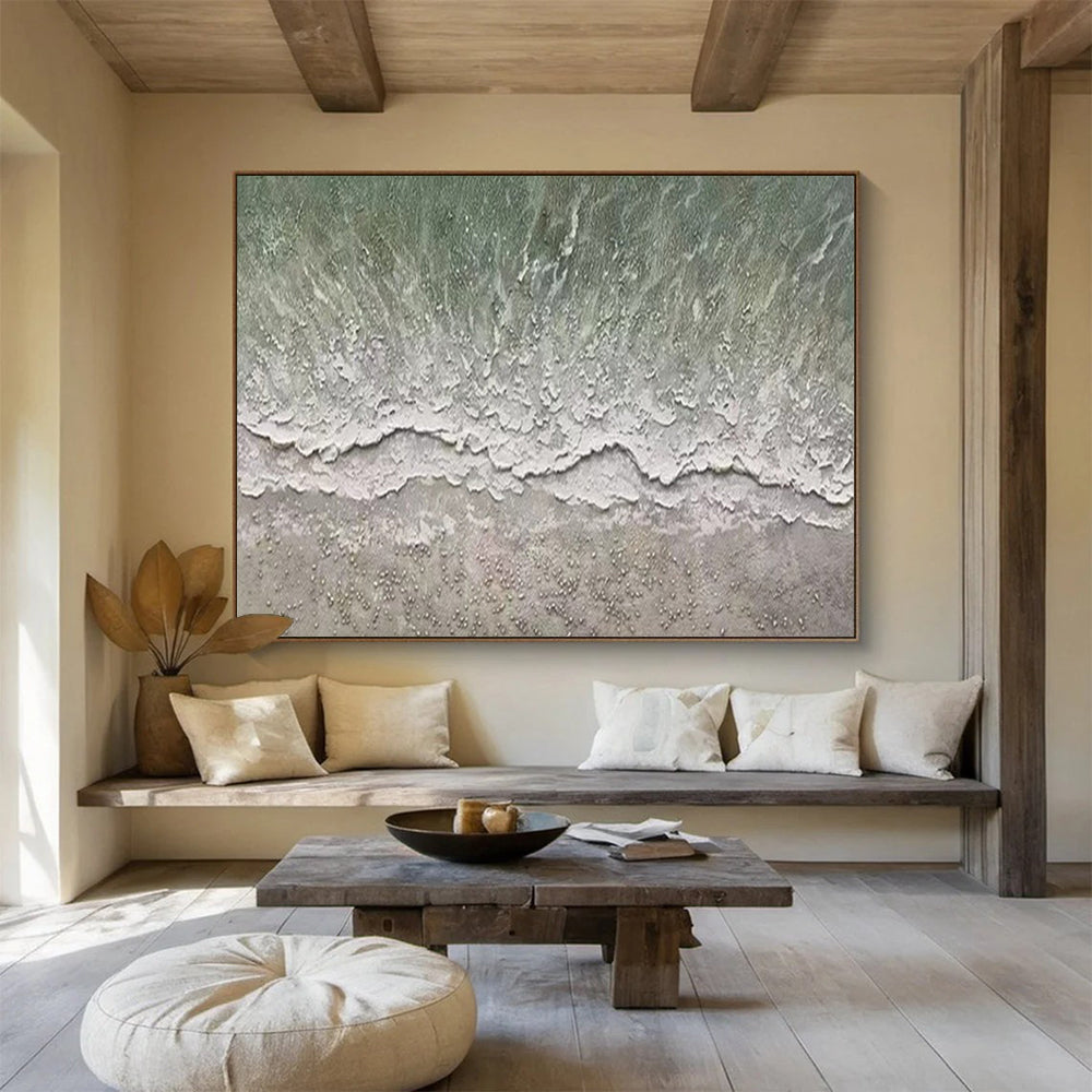 Aerial view of a beach with gentle waves and a textured shore CT1667