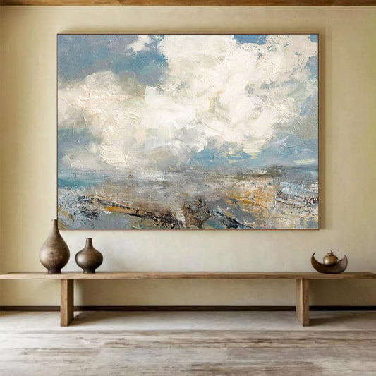 Seascape with fluffy clouds, blue sky, and a textured shoreline CT1665