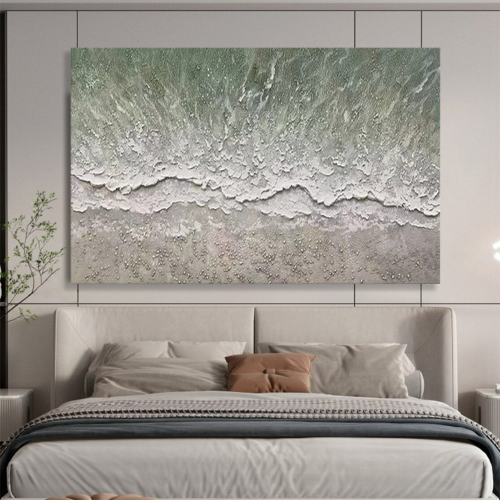 Aerial view of a beach with gentle waves and a textured shore CT1667