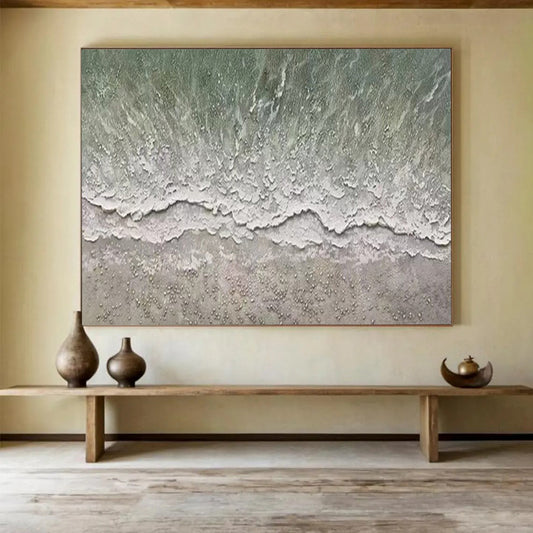 Aerial view of a beach with gentle waves and a textured shore CT1667