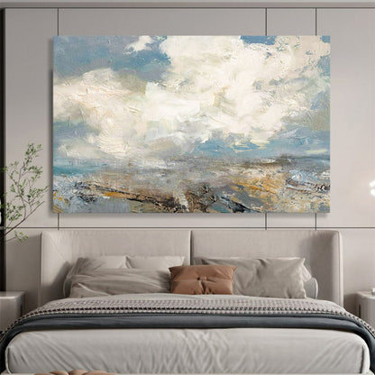 Seascape with fluffy clouds, blue sky, and a textured shoreline CT1665