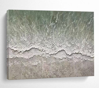 Aerial view of a beach with gentle waves and a textured shore CT1667
